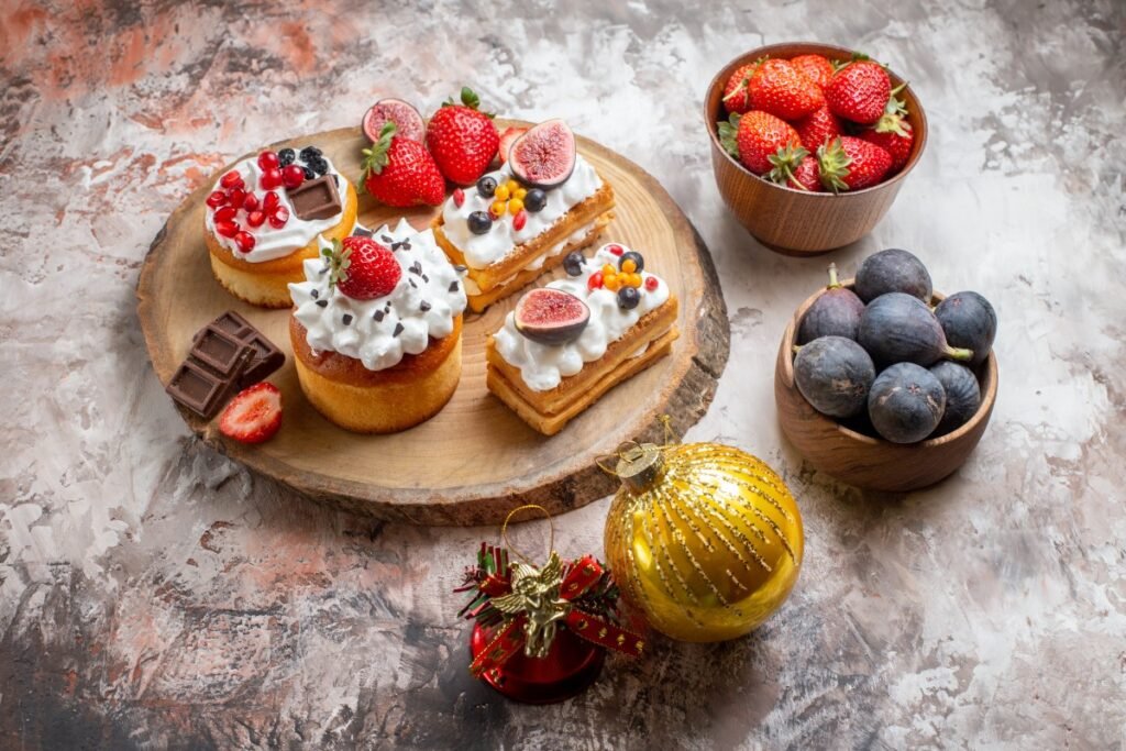 Front View Delicious Cakes With Fresh Fruits Light Background Christmas Cake Dessert Color Biscuits 1 1024x683